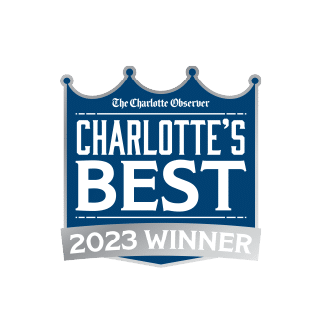 Badge with “The Charlotte Observer” and “Charlotte’s Best 2023 Winner” text, featuring a crown-like design in blue and silver tones.
