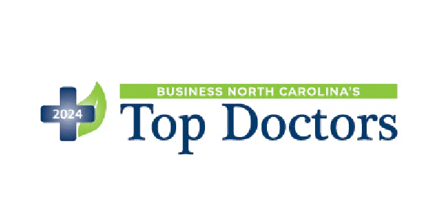 A logo featuring "Business North Carolina's 2024 Top Doctors," with a blue and green design, emphasizing healthcare recognition.