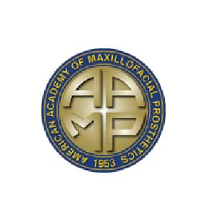 Logo featuring "American Academy of Maxillofacial Prosthetics" in blue and gold. Center design includes stylized letters "AAMP" with the founding year, 1953.