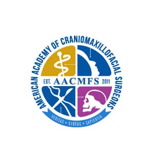 The logo features a divided circle with symbols of medical practice, silhouette, and skull, surrounded by "American Academy of Craniomaxillofacial Surgeons."