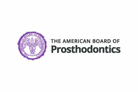 Logo of the American Board of Prosthodontics featuring a purple seal with a bird symbol and text beside it.