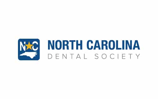 Logo of the North Carolina Dental Society featuring state outline, star, and initials "NCDS" in blue and white color scheme.
