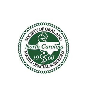 Society of Oral and Maxillofacial Surgeons logo features North Carolina map, snake staff symbol, and "1960" in a green and white circular design.