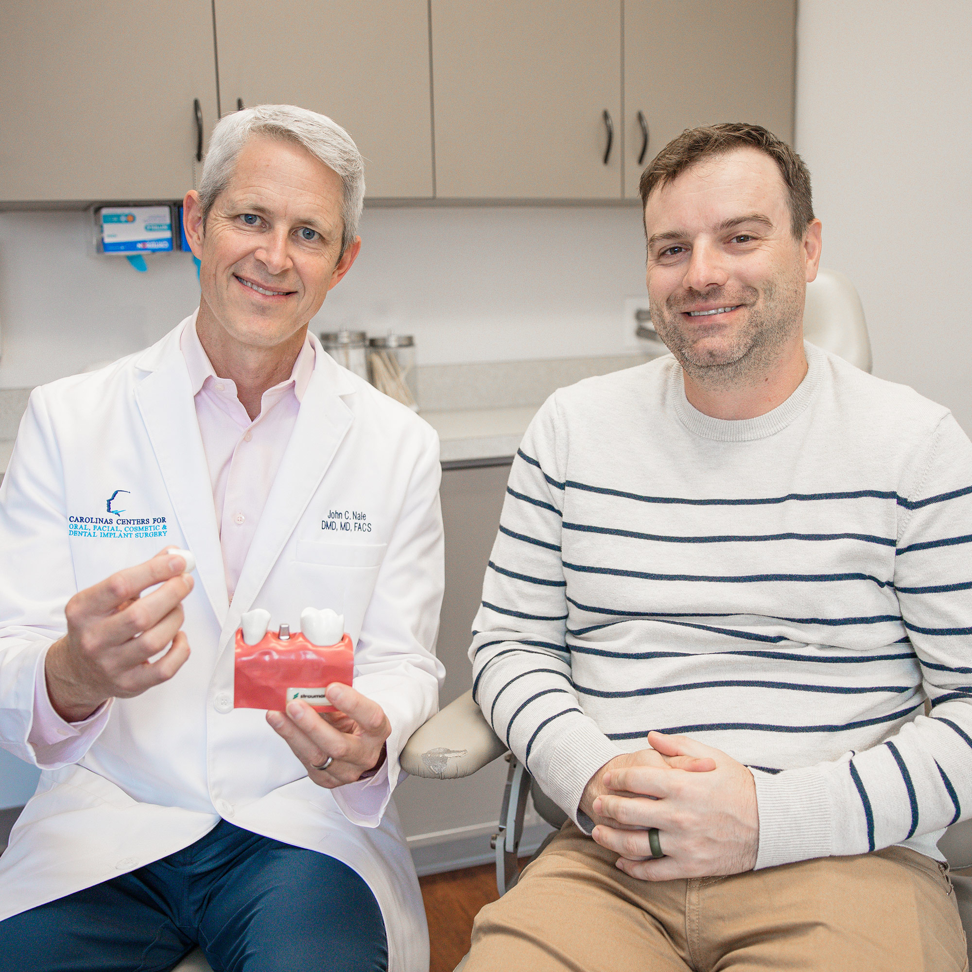 Dr. John Nale, Oral & Maxillofacial Surgeon in Charlotte, NC with patient