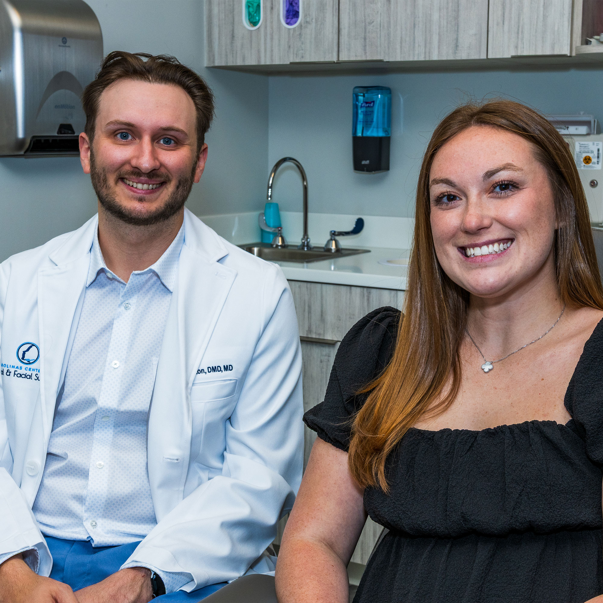Dr. Tyler Horton, Oral & Maxillofacial Surgeon, smiling with patient
