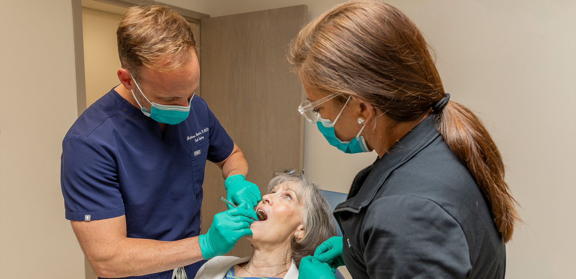 Matthew Nimmich, Oral & Maxillofacial Surgeon in West Columbia, SC with patient