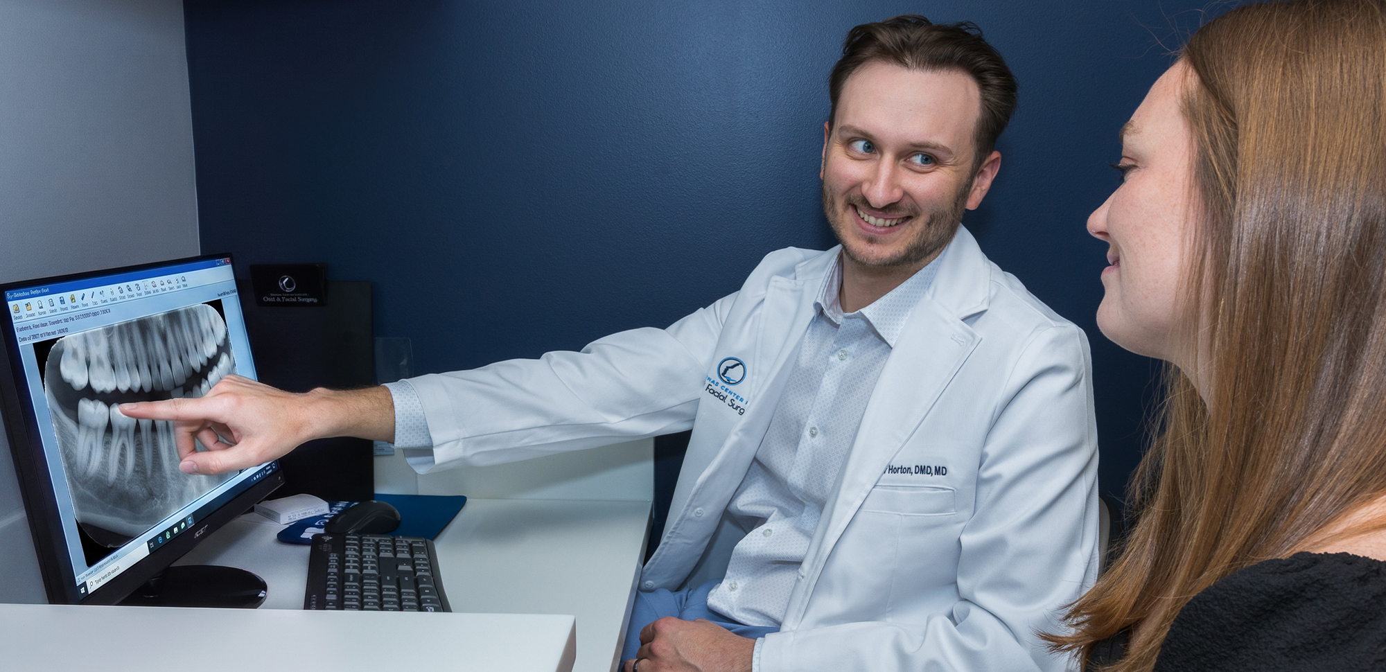 Dr. Tyler Horton, Oral & Maxillofacial Surgeon with patient