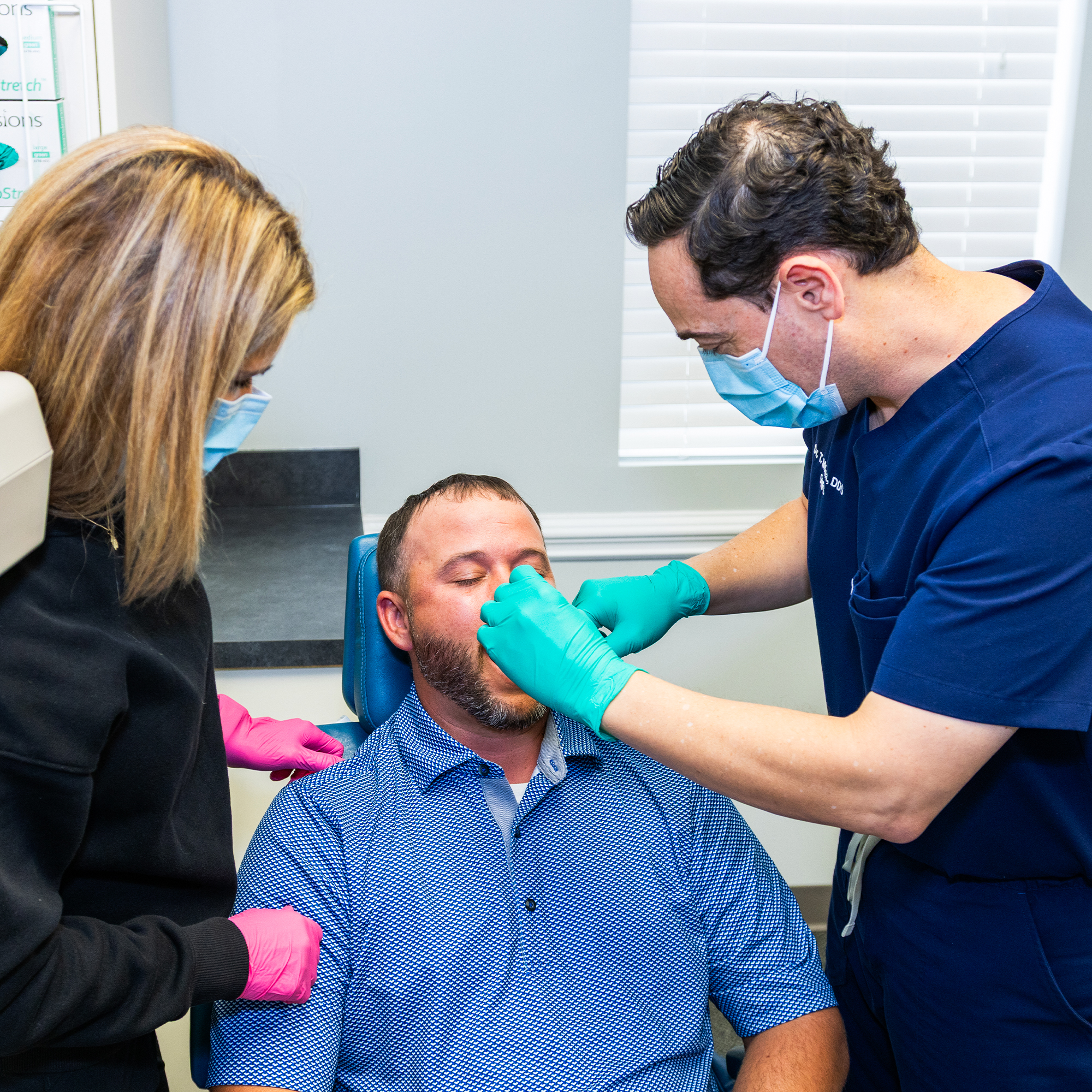 Dr. Molina providing an oral exam on patient
